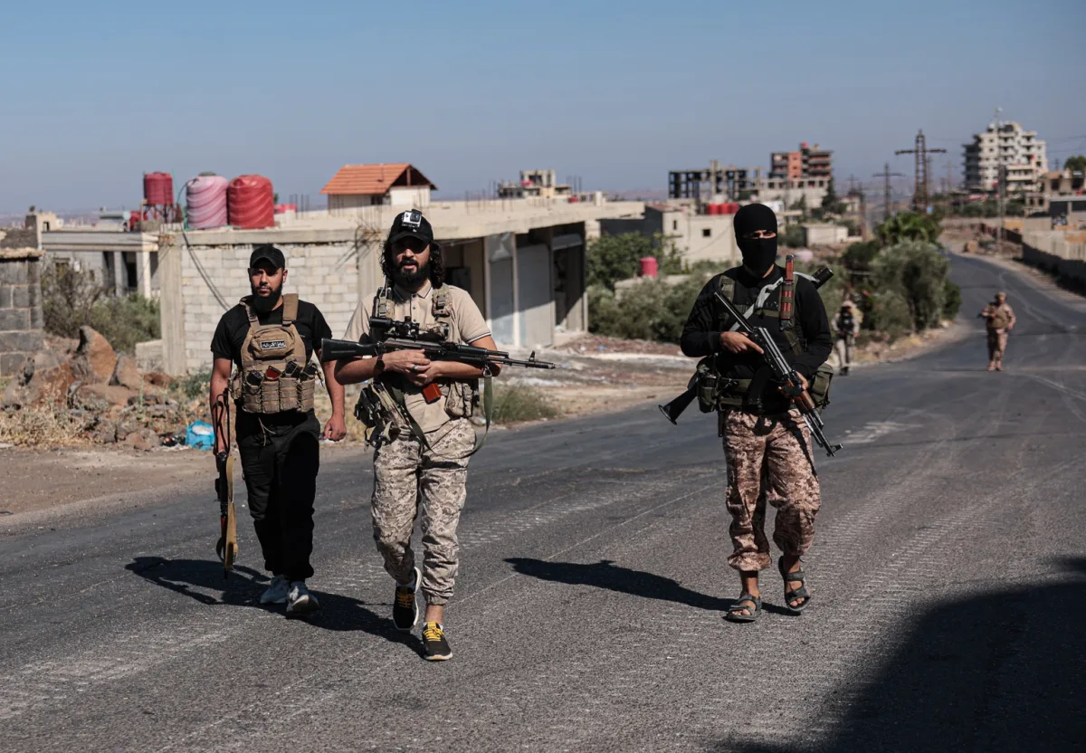 epa12240524 Syrian security forces deploy amid ongoing clashes in the southern city of Sweida, 16 July 2025. Damascus deployed troops in the predominantly Druze province of Sweida after clashes between Druze fighters and Bedouin tribes resulted in the death of dozens of people. The Syrian Defense Minister announced a ceasefire on July 15 in the city of Sweida, which Syrian troops entered in the morning, but the area is witnessing violent clashes between government forces and Druze militants. EPA/MOHAMMED AL RIFAI